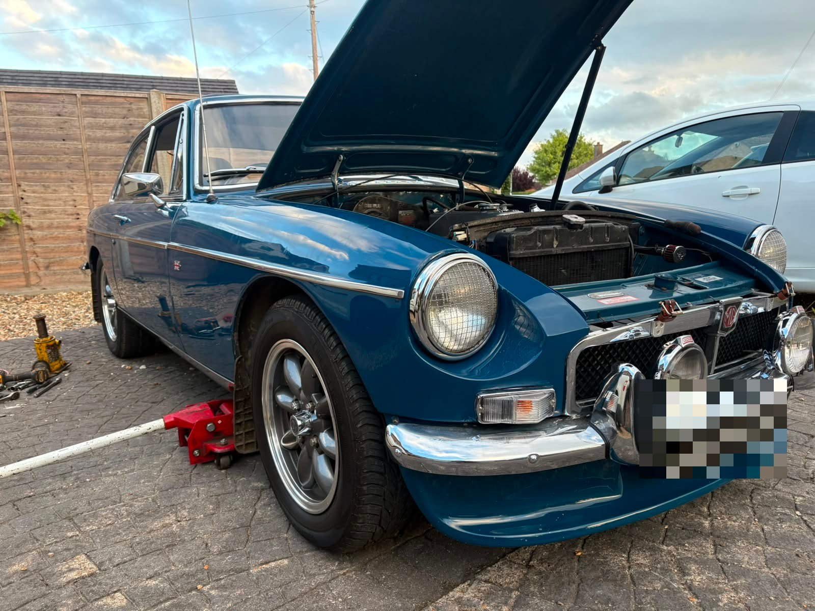 Classic blue MGB GT with bonnet open during mobile service by Go Go Garage